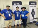 Andy Milluzzi, KK4LWR; his brother Tony Milluzzi, KD8RTT; and Morgan Lyons, KI5SXY, at the 2024 ARRL Youth Rally. 