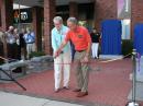 ARRL President Kay Craigie, N3KN, and Second Century Campaign Committee Chairman David Brandenburg, K5RQ, cut the ribbon at the Centennial Terrace dedication July 17 at ARRL Headquarters. [Rick Lindquist, WW1ME, photo]