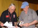 ARRL Midwest Division Director Cliff Ahrens, K0CA, goes over a DXCC application at the ARRL EXPO. [S. Khrystyne Keane, K1SFA, photo]