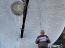 Al Ward, W5LUA, holds his WAS certificate in front of his 5-meter dish. [Photo courtesy of W5LUA]