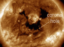 Solar wind flowing from this double equatorial coronal hole should graze Earth's magnetic field on Oct 1-2. [Photo courtesy NASA SDO/AIA]