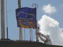 A replica of the North Pole flag flown by the USS Nautilus in 1958 is raised over the historic ship during anniversary ceremonies, August 3, 2008.