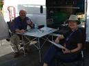 Phil, KG6ILU, and Louise, KG6IMA, demonstrate the value of ham radio for emergency communications to the crowds at the San Mateo Maker Faire. More photos are available online. [Phil Stripling, KG6ILU, Photo]