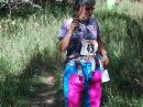 Ruth Bromer, WB4QZG, of Raleigh, North Carolina, leaves the starting line of last year’s USA ARDF Championships in New Mexico. She is carrying an 80 meter ARDF set with a loop antenna in her right hand. It is customary to use headphones with these sets. [Joe Moell, K0OV, Photo]